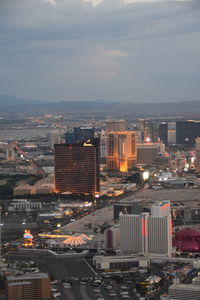 High angle view of illuminated buildings in city against sky