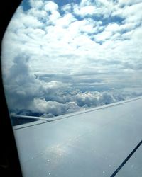 Aerial view of clouds seen from airplane window