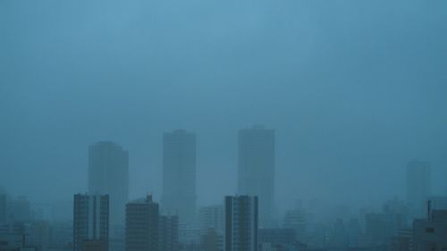 Modern buildings in city against sky