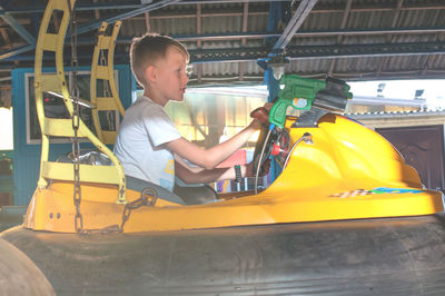 Boy playing in amusement park