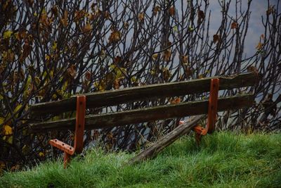 Metallic structure on field against sky