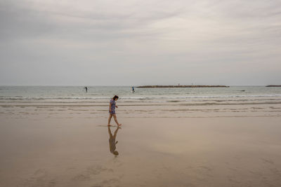 Woman walking at beach