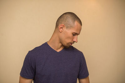 Portrait of young man against white background