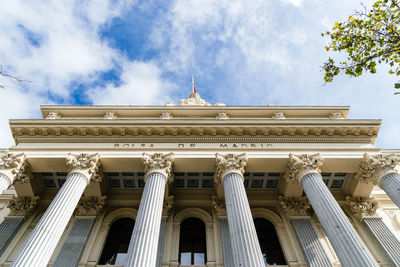 Low angle view of historical building against cloudy sky