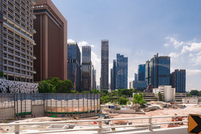 Modern buildings in city against sky