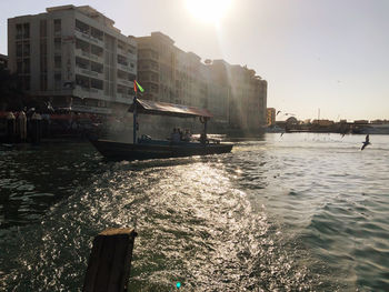 View of city by sea against clear sky