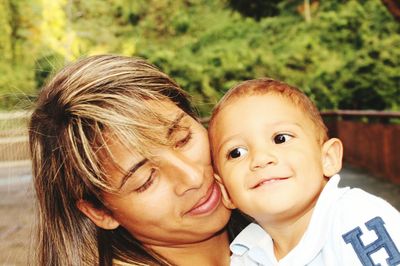 Close-up of mother with cute son at home