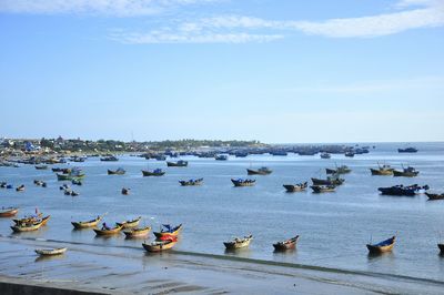 Boats in sea against sky