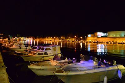 Boats moored at harbor