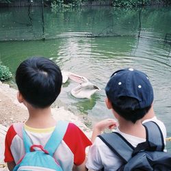 Woman standing by lake