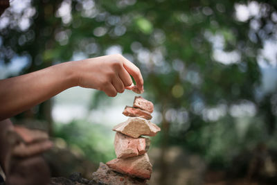 Close-up of hand holding wood