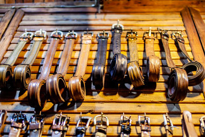 Close-up of belts at market stall for sale