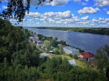 High angle view of buildings and trees against sky