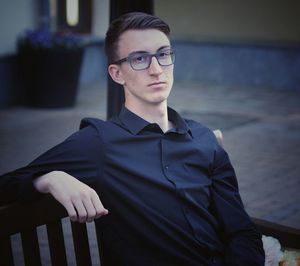 Handsome man sitting on bench