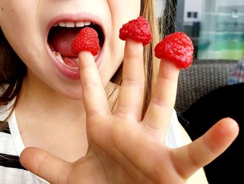 Close-up of woman eating fruit