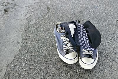 High angle view of shoes on street