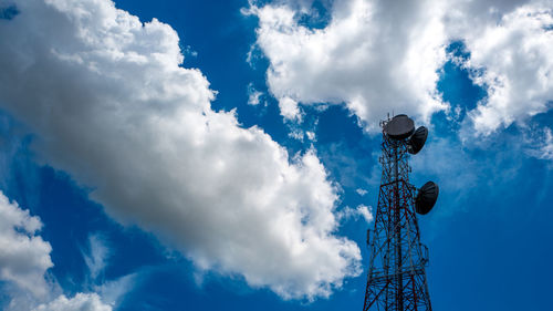 Low angle view of communications tower against sky