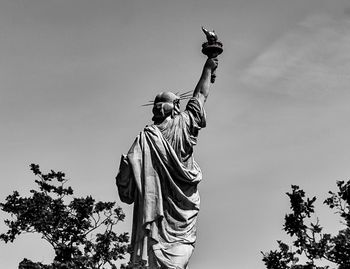 Low angle view of statue against sky