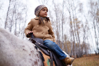 Young man with horse in winter