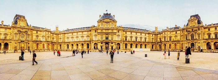 Tourists in front of historical building