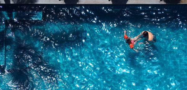 Woman swimming in pool