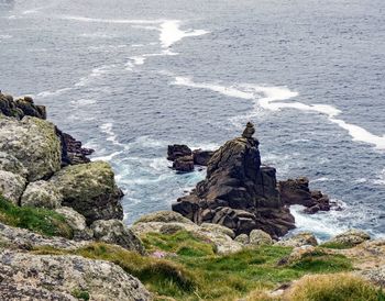 High angle view of rocks on sea shore