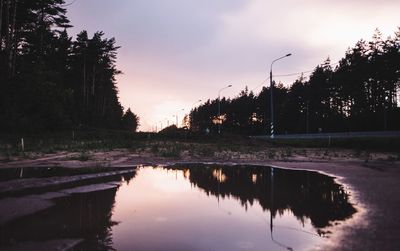 Scenic view of lake against sky during sunset