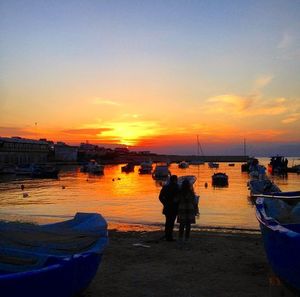 Boats moored at harbor