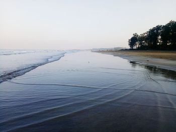 Scenic view of sea against clear sky during winter