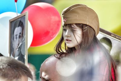 Portrait of woman with balloons