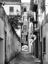 Narrow alley amidst buildings in town