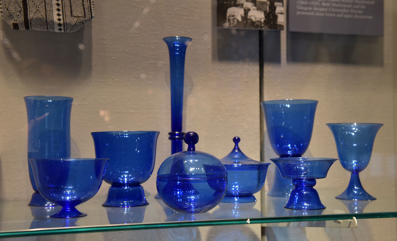 CLOSE-UP OF GLASSES ON SHELF