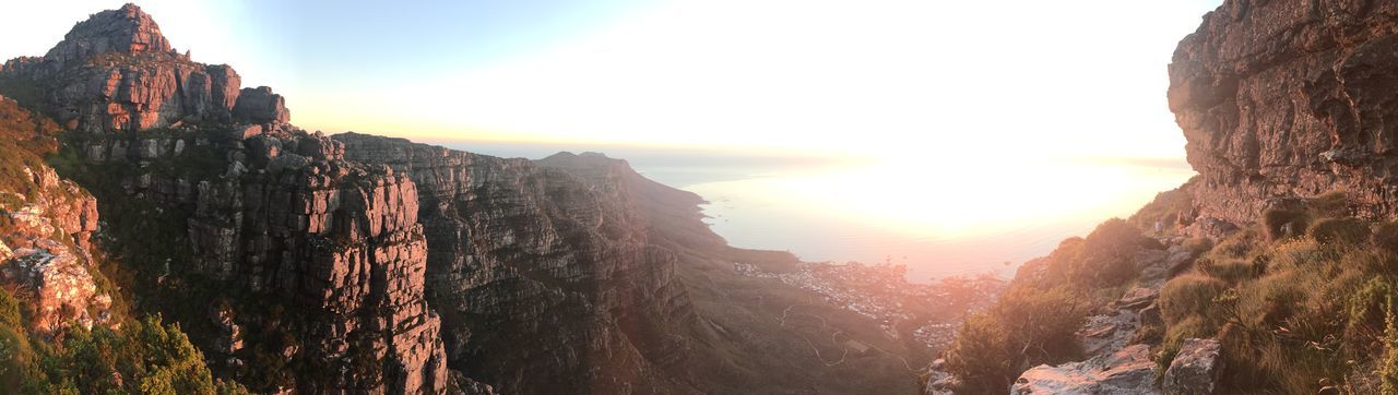 sun, tranquility, rock formation, tranquil scene, scenics, sunset, sky, beauty in nature, sunlight, nature, mountain, rock - object, lens flare, sunbeam, cliff, idyllic, non-urban scene, physical geography, tourism, geology