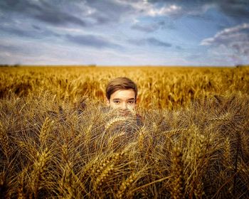 Portrait of man on field against sky