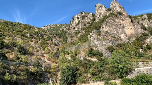 Scenic view of mountain against blue sky