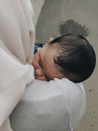 High angle view of cute baby sleeping