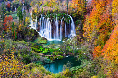 Waterfall in forest during autumn