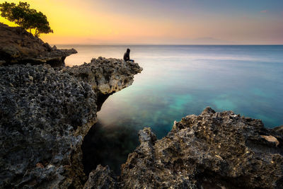 Scenic view of sea at sunset