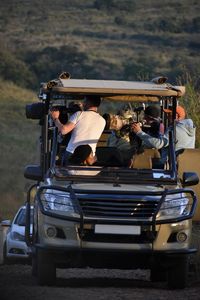 Rear view of people on road