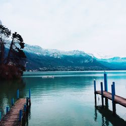 Pier over lake against mountains