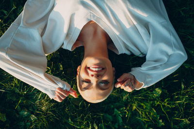 Directly above shot of woman lying on grass