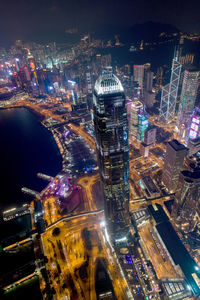 High angle view of city lit up at night