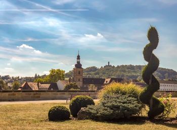 Panoramic view of trees and buildings against sky