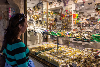 Woman standing at market stall