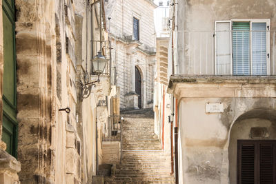 Narrow alley amidst buildings in city