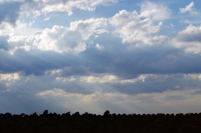 Scenic view of landscape against cloudy sky