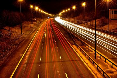 High angle view of light trails on road