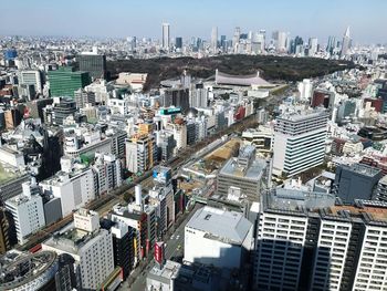 High angle view of modern buildings in city against sky