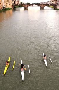 High angle view of men boating in river