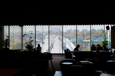 Woman sitting on table in city